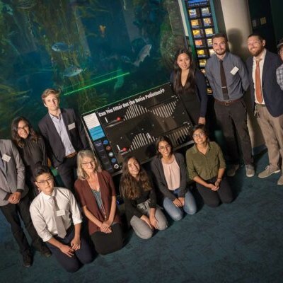team photo of exhibit installation for interactive aquarium prototype